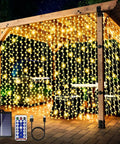 Gazebo adorned with 600 LED Solar Curtain Lights With Remote, Outdoor Fairy String Lights For Gazebo And Patio, Waterproof Waterfall Design, solar panel and USB cable visible