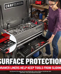 Rolling Tool Chest With Drawers And Locking Steel Cabinet Power Outlets And USB Port Four Swivel Casters Red Built Tough Utility Cart Holds Up To 700 Lbs Surface Liners Included with tools inside, showing surface protection and drawer liners in workshop.