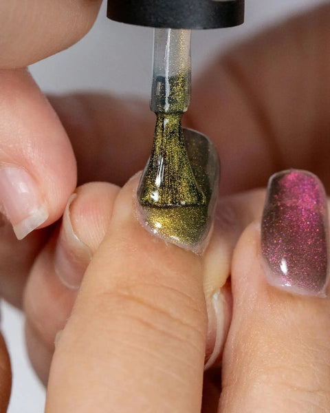 Applying Mystic Galaxy 9D Cat Eye Gel Nail Polish Set With Jelly Cat Eye Effect, creating magnetic light play finish.