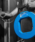 Person using Sturdy 100 ft Stainless Steel Fish Tape With Metal Eyelet Tuff Grip Pro Case For Wet Environments And Tight Bends Nylon Jacketed Pulling Tool Built For Easy Wire Runs indoors.