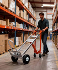 Heavy Duty Aluminum Three In One Convertible Hand Truck With Smooth Rolling Caster Wheels, Zero Hassle Assembly Folding Moving Dolly Cart in use in warehouse.