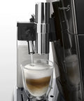 Real Deal Fully Automatic Espresso Machine With Single Touch Lattecrema Setup For Creamy Cappuccino Foam pouring into a glass.