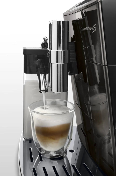 Real Deal Fully Automatic Espresso Machine With Single Touch Lattecrema Setup For Creamy Cappuccino Foam pouring into a glass.