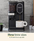 Single Serve Coffee Maker And Grinder For Home Or Office All In One No Fuss Setup with mug and coffee pods on countertop.
