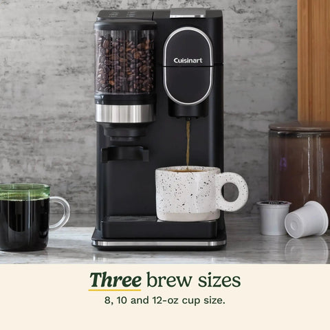 Single Serve Coffee Maker And Grinder For Home Or Office All In One No Fuss Setup with mug and coffee pods on countertop.