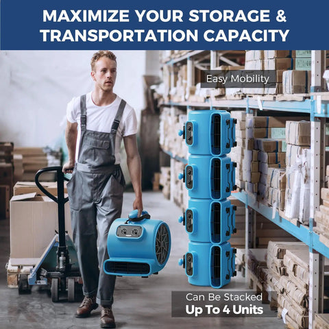 Man carrying Powerhouse 2000 CFM Air Mover for industrial drying and water damage restoration with stackable design in warehouse