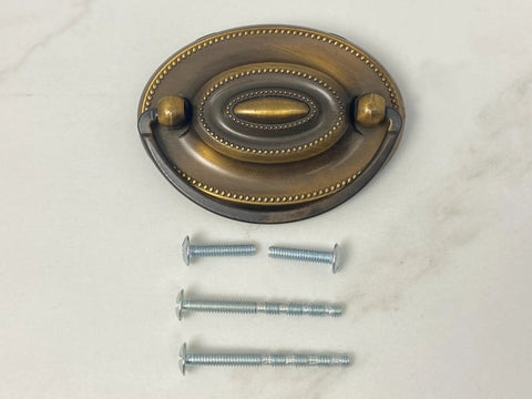 Oval Dresser Pulls Set, Two And A Quarter Inch Center To Center, Antique English Finish, shown with included screws on white background