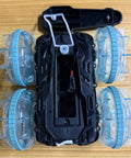 Top view of Amphibious 4WD RC Car And Boat Hybrid With Waterproof Design showing open battery compartment and clear wheel design.
