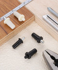 Heavy Duty Plantation Shutter Repair Pins, Spring Loaded Metal Pins For Louvers Windows, 100 Pack White, anti-slip grip pieces arranged on wood.