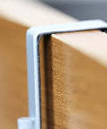Close-up of silver mount on cabinet for Two Pack Over The Cabinet Door Organizer Holder Set With Wall Mount Basket And Over The Door Shelf 13.5W X 4.25D X 9.25H And 12.5W X 3.6D X 9.25H Fits Inside Cabinets Or Over Doors Silver Finish Easy Install Space Saver For Real