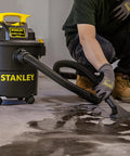 Powerful 5 Gallon Wet Dry Shop Vacuum With 4 Peak HP, 85 CFM in use cleaning wet floor, features swivel casters and 3 in 1 blower.