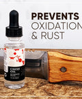 Choji Oil Tool Cleaning Kit For Knife And Sword Care With Rust Eraser And Lint Free Cloth Included, bottle next to knife.