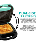 Chill Mint Green MyMini Personal Sandwich Maker Panini Press showing dual-sided cooking with grilled sandwich in view.