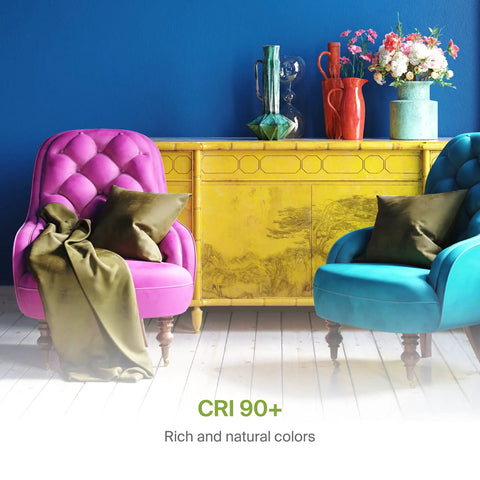 Colorful living room showcasing CRI 90+ lighting with bright pink and blue chairs against a vibrant backdrop.