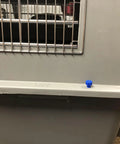 Close-up of Drop In Hardware Upgrade For Plastic Pet Carriers And Portable Dog Crates Featuring Sixteen Bad Boy Seven Eighth Inch Steel Bolts with blue thumb screws.