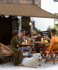 80 Percent Mesh Shade Cloth With Grommets For Backyard Garden Greenhouse And Patio, installed over patio with people seated underneath