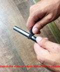 Hands using Survival Ferro Rod Fire Starter Kit With Drilled Ferrocerium Rod, 4 Inch Long By 0.375 Inch Diameter, Paracord Lanyard.