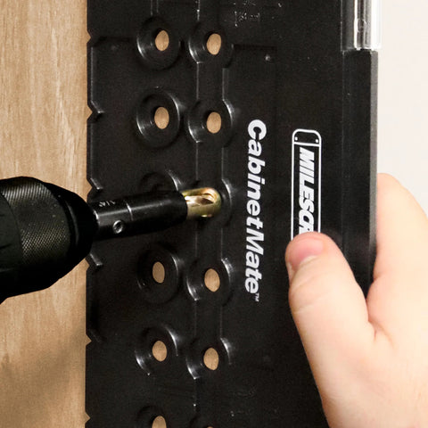 Milescraft 2312 5mm ShelfPinBit for drilling shelf pin holes on black CabinetMate jig (front view)