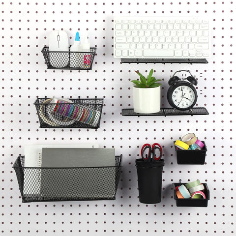 Pegboard with black mesh baskets, keyboard, clock, plant, and stationery items from All In One Pegboard Organizer Kit With 3 Racks 3 Baskets 8 Bins 4 Cups 8 Hooks 4 Loops And Cup Holder For Garage And Home Wall Mount Storage System Durable Black.