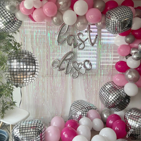 Showstopping 22 Inch Silver Disco Balloons Pack of 6 4D Sphere Balloons for Disco Party Decorations Retro 70s Theme Birthday Anniversary Decor and Photo Backdrops for Lit Party Vibes amid colorful setup