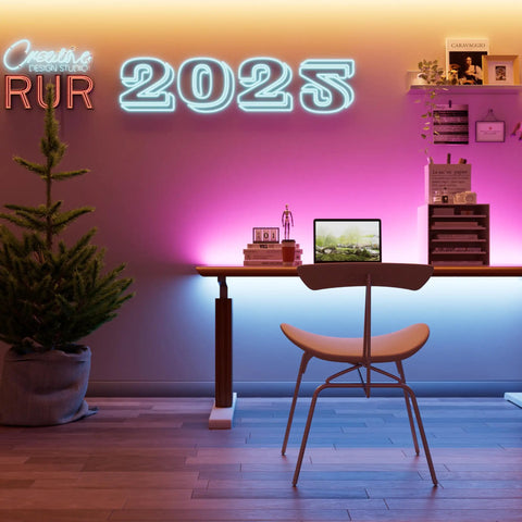 Modern workspace with Color Changing RGB COB LED Strip Light For Cabinets And Rooms, glowing neon "2025" sign, sleek desk setup.