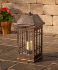San Rafael II Solar Mission Lantern With Dual High Performance Warm White LEDs And Amber Pillar Accent on stone patio