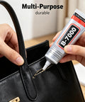 Heavy Duty Clear Industrial Glue Delivers A Hella Tough Bond And Precision Needle Tip For Jewelry Rhinestone Crafts Cell Phone Screen Repairs And Smooth Diy Projects applied on a black purse repair.