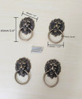 Antique Bronze Lion Head Ring Pull Cabinet Handles Set Of 4 With Screws, 2.6 Inches Long By 1.6 Inches Wide, displayed on table