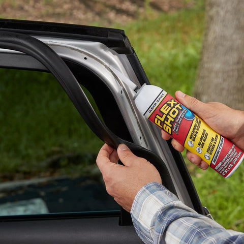 Applying Rubber Adhesive Sealant Caulk Eight Ounce Clear Flexible Bonding Sealant to a car door seal to prevent leaks.