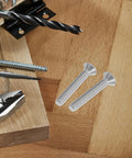 Flat Head Socket Screws Heavy Duty Stainless Steel 5/16-18 Full Thread for Furniture and Bed Frame Connections on wood surface next to tools