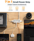 Premium 5 Ft Extension Cord Power Strip With Hella Good 900 Joule Surge Protection Flat Plug Head Four Ac Outlets Plus Usb Ports Charges Seven Devices Simultaneously Smooth Setup For Any Room on a wooden desk.