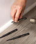 Using Pro Grade 3 Piece 5 Inch Steel Punch Set with black oxide finish, laser etched size markings, knurled handles for firm grip on wood floor