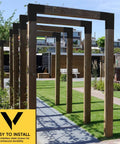 Installed Heavy Duty 14 Gauge Steel L Shaped Pergola Brackets 1 Pack for 4x4 Wood Beams on outdoor structure, matte black.