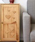 Heavy Duty Acrylic Heart Router Template For Practical Woodworking And Charcuterie Boards Features Twelve Cut Sizes Providing Flawless Trimming Lines on a wooden cabinet.