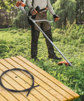 Easy Fit No-Fuss Flexible Driver Shaft Inner Cable for Brushcutters on table with person using brushcutter in garden