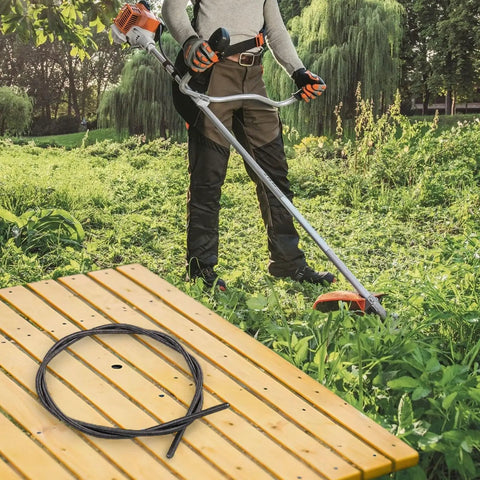 Easy Fit No-Fuss Flexible Driver Shaft Inner Cable for Brushcutters on table with person using brushcutter in garden
