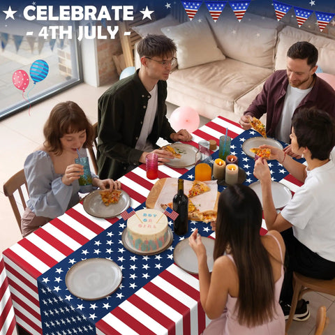 People dining on Patriotic Fourth Of July Tablecloth Set Two Pack 54 By 108 Inches Plastic Outdoor Party Cover with American flag design.