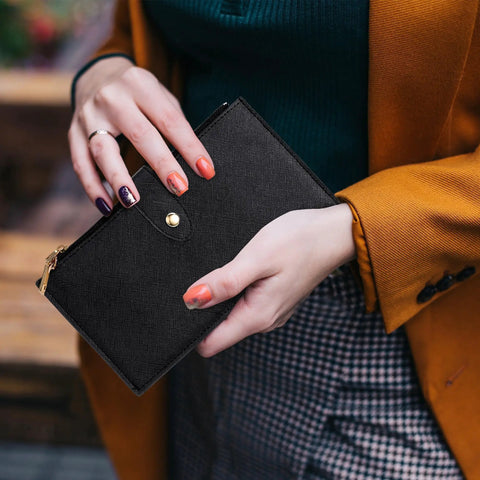 Person holding RFID Blocking Wallet For Women Large Capacity Bifold Card Holder with Zipper Pocket in black leather