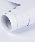 Close-up of Matte White Easy Peel And Stick Wallpaper roll showing thick textured surface for cabinets and countertops