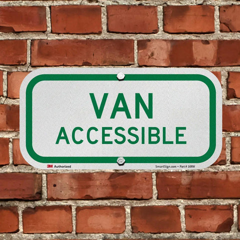 Heavy Duty Six By Twelve Inch Van Accessible Metal Sign Built Tough With Sixty Three Mil Aluminum And Legit 3M Engineer Grade Reflective Coating In Clean Green On White, mounted on a brick wall.