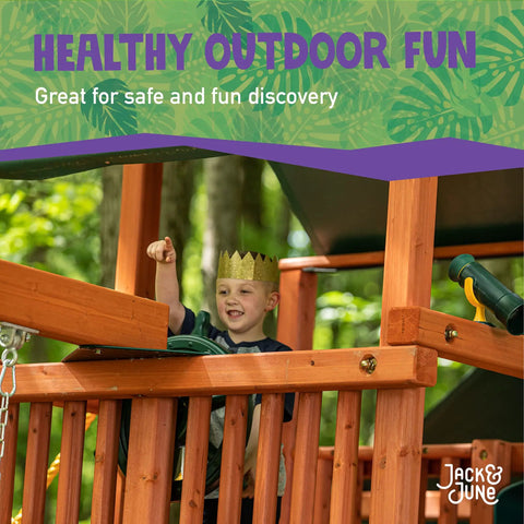 Child playing on wooden playset featuring a Captain Ship Wheel Swing Set Accessory with 20-inch 360-degree rotating wheel.