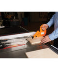 Person using 11 In 1 Table Saw Push Stick With Rear Hook And Toe Grip Angle Guides for precise safe cuts on table saw