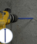 Heavy Duty Blue Hex Head Concrete Screw Anchors PTFE Coated Carbon Steel 1/4 In X 2-3/4 In 200 Pc Bulk Pack drilled into concrete wall