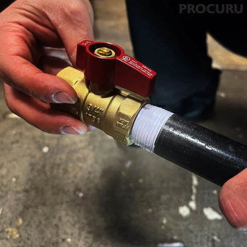Person installing pipe with Liontape G701 Heavy Duty PTFE Teflon Pipe Thread Sealant Tape Half Inch By Twelve Hundred Inches 4 Mil