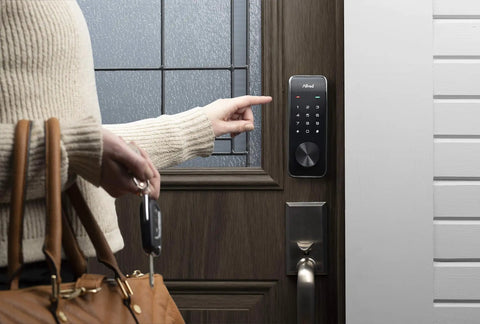 Person using Smart Door Lock Deadbolt With Touchscreen Keypad, Pin Codes And Key Entry, Bluetooth Remote Unlock, Up To 20 Access Codes, Gold Finish