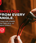 Person holding ANSI Z87.1 clear safety glasses with side shields, emphasizing anti-fog and scratch-resistant features.