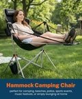 Woman relaxing in hammock chair with footrest for adults up to 400 lbs, heavy duty outdoor rocker with cup holder on lawn