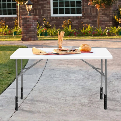 Table with metal risers increasing height, showing Table Leg Extenders For Folding Tables Adjustable Metal Risers For Bent And Straight Legs 4 Pack Raises Height From 3.6 To 7.8 Inches Back Saver Easy Install Without Compromising Stability in outdoor setting.