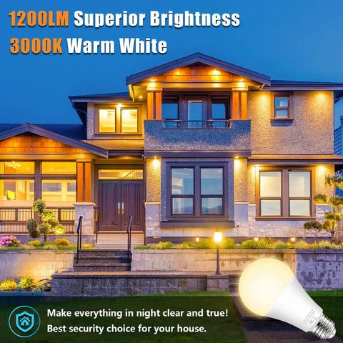 House illuminated with Dusk To Dawn Outdoor Sensor Light Bulbs No Fuss Auto On Off 11W LED 100W Equivalent Warm White 4 Pack