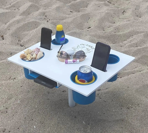 Portable Beach Table With Two Phone Slots, Lightweight Yet Sturdy And Durable, Must Have For Beach, Boat, Pool, Backyard, RV And Camping, Keeps Drinks And Phones Off The Sun With Built In Tray For Stash And Gear on sand